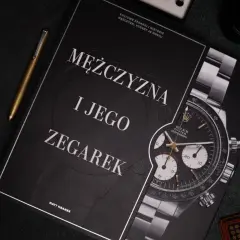 Okładka książki "Mężczyzna i jego zegarek" z widocznym zegarkiem Rolex Daytona.