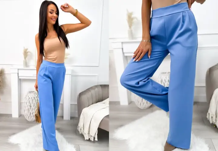 Eleganckie błękitne spodnie palazzo, idealne do letnich stylizacji. Modelka prezentuje je z beżowym topem.