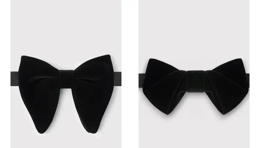 Dwie czarne, aksamitne muchy. Jedna z nich jest bardziej rozłożysta, druga bardziej zwarta. Elegancki dodatek, który może zastąpić krawat.